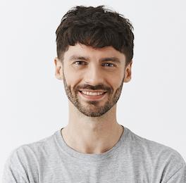 man-smiling-in-white-shirt